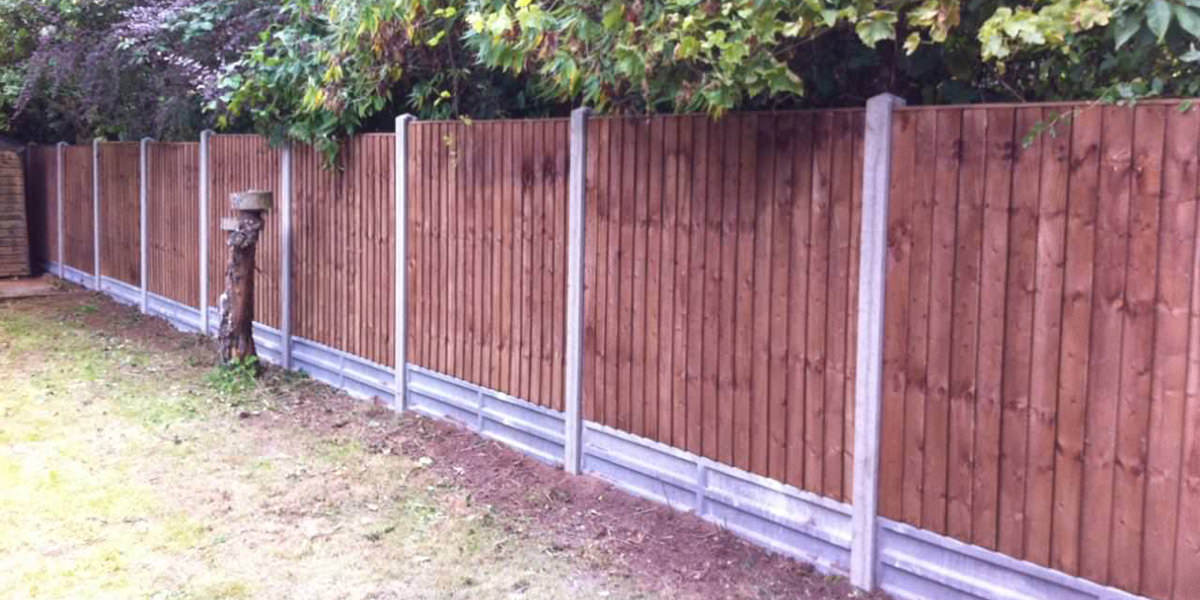 Concrete posts with featheredge panels